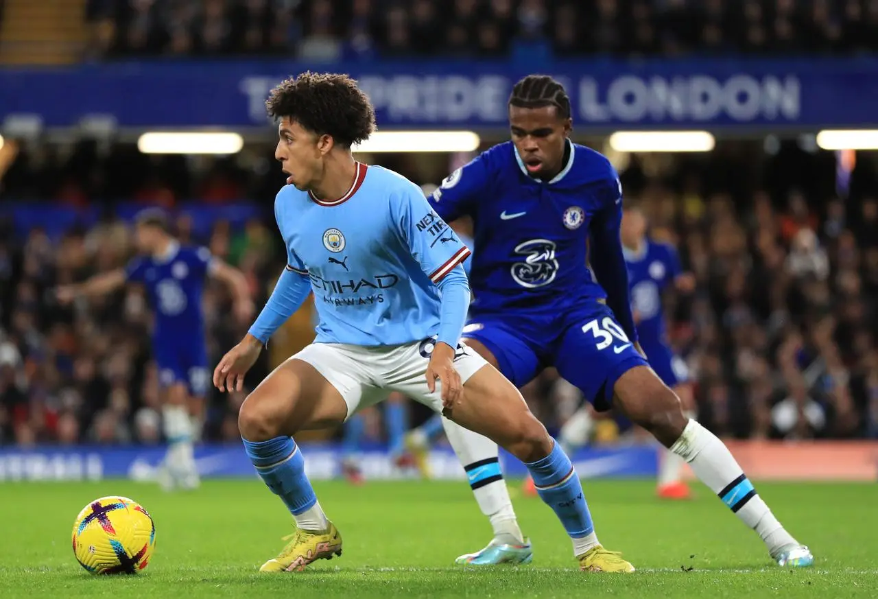 Rico Lewis, left, impressed for City