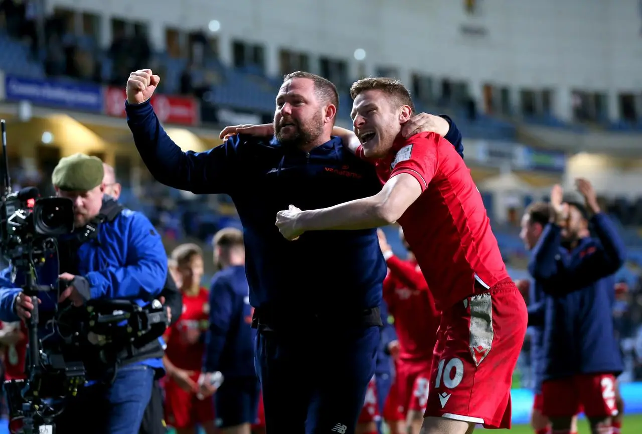 Wrexham’s Paul Mullin, right, celebrates Wrexham's win at Coventry