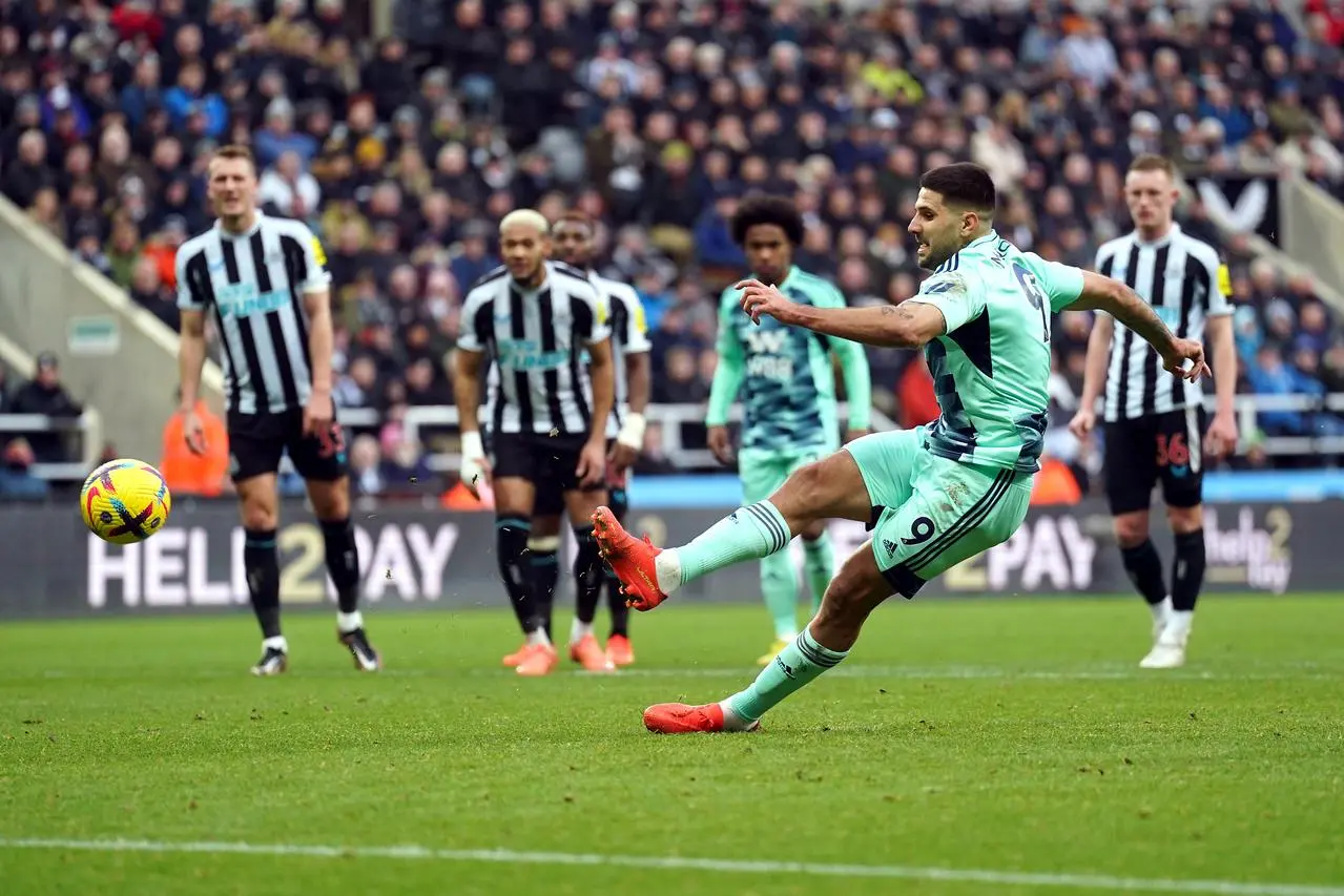 Aleksandar Mitrovic takes his penalty against Newcastle