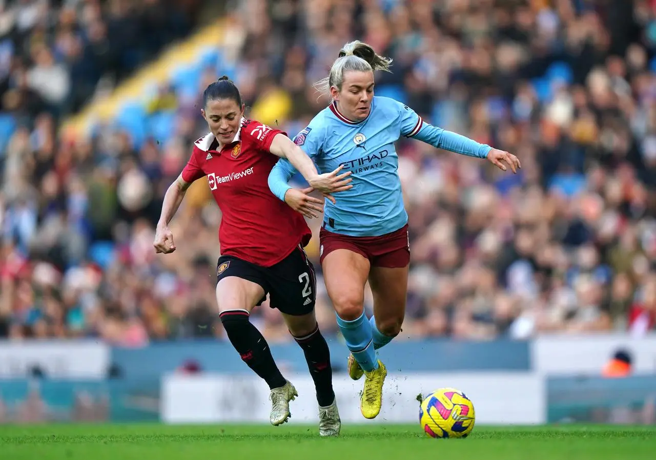 Manchester United’s Ona Batlle (left) and Manchester City’s Lauren Hemp battle for the ball (Tim Goode/PA).
