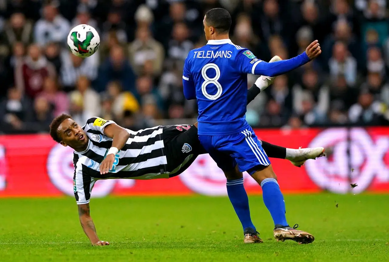 Joe Willock, left, and Youri Tielemans battle for the ball