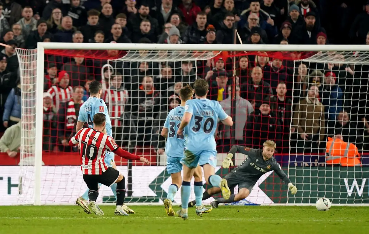 Billy Sharp, left, scores Sheffield United's second goal