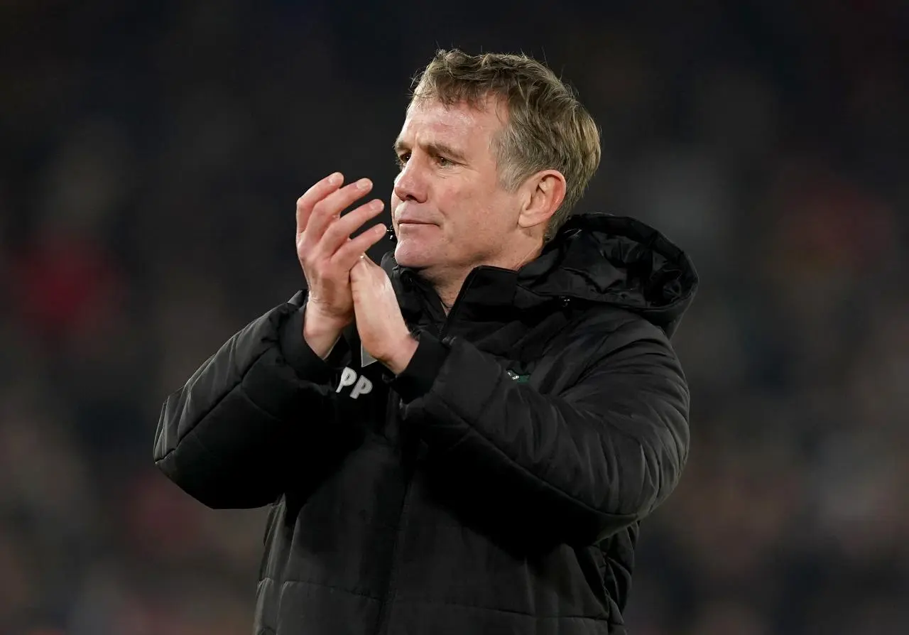 Phil Parkinson applauds the Wrexham fans at full-time