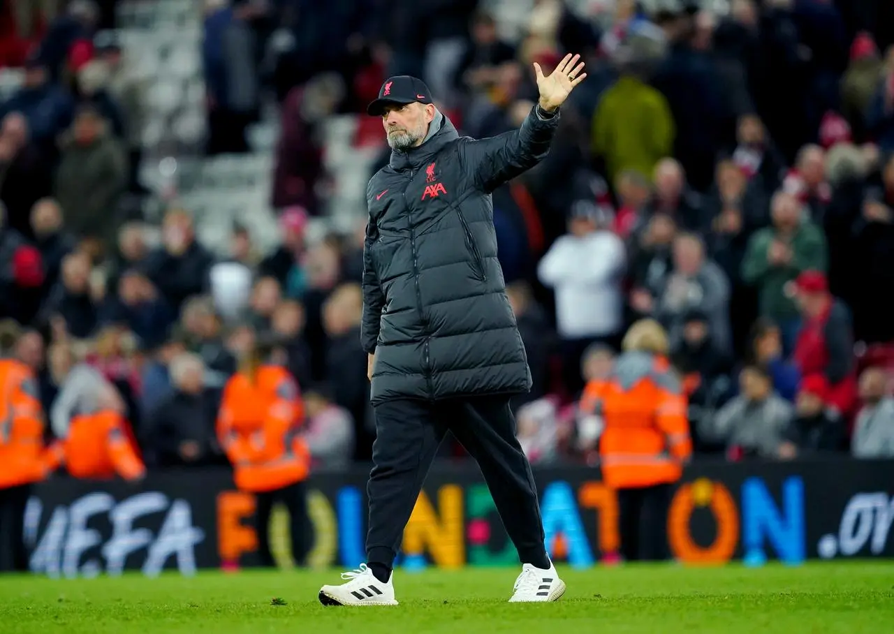 Jurgen Klopp waves to the fans at full-time