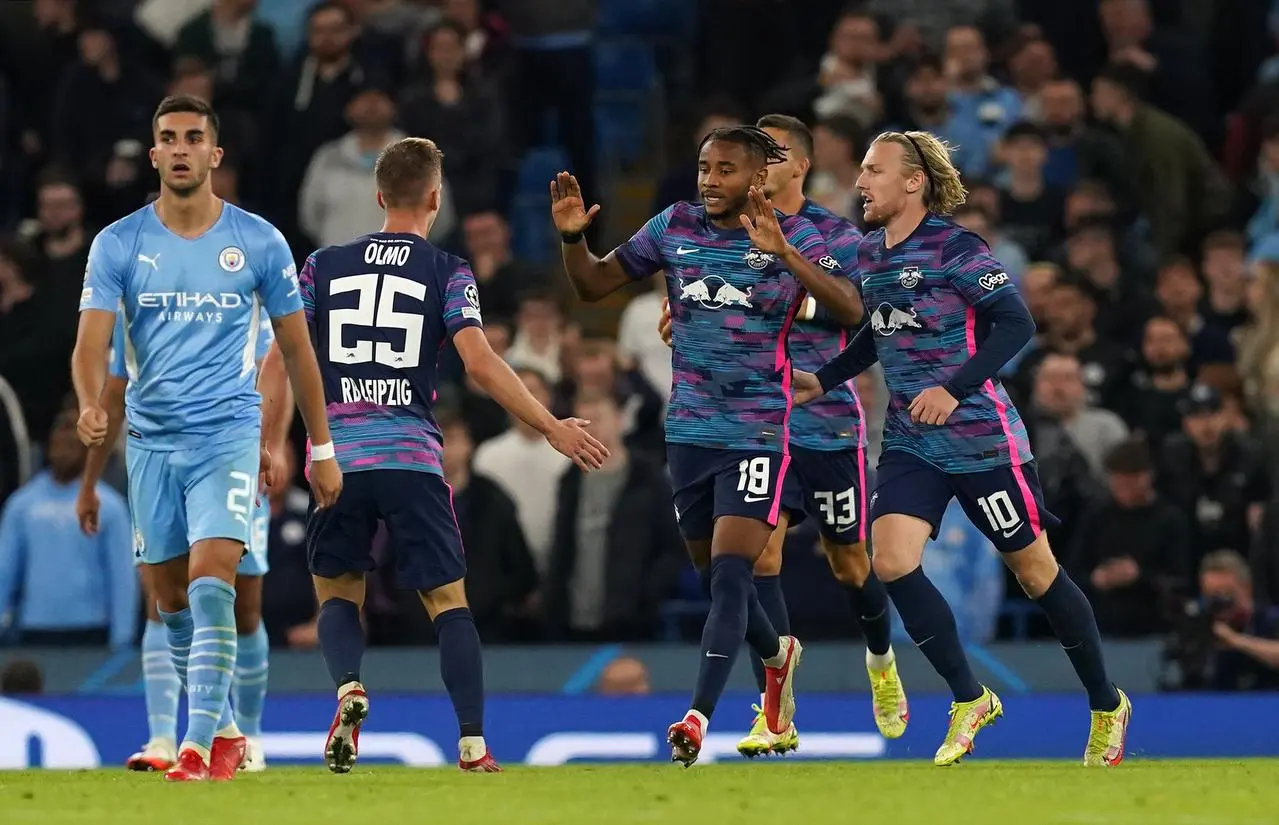 Christopher Nkunku celebrates scoring against Manchester City