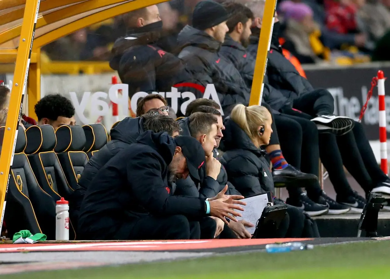 Liverpool manager Jurgen Klopp lowers his head in the dugout