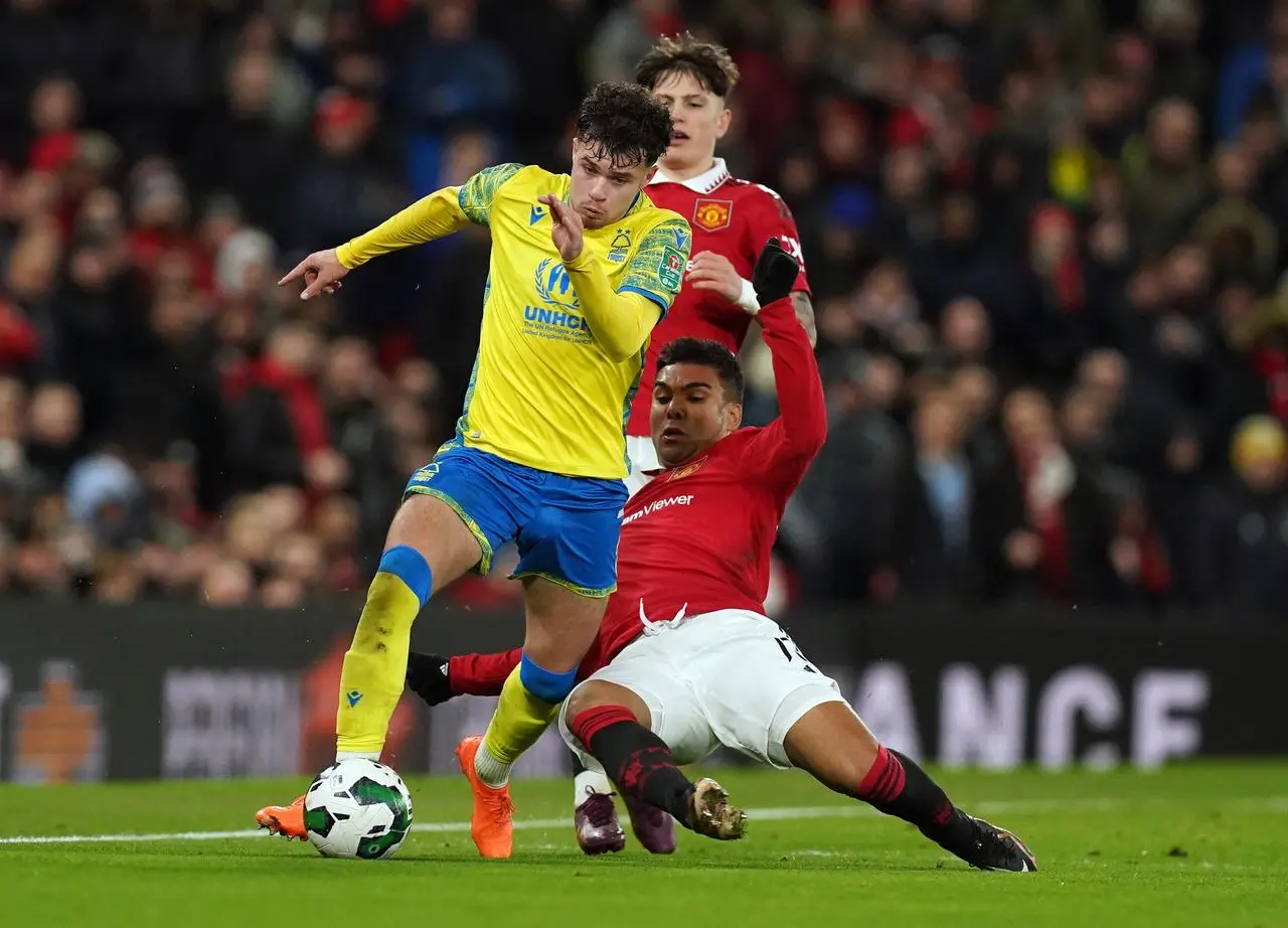 Casemiro slides in on Nottingham Forest’s Neco Williams during the Carabao Cup semi-final