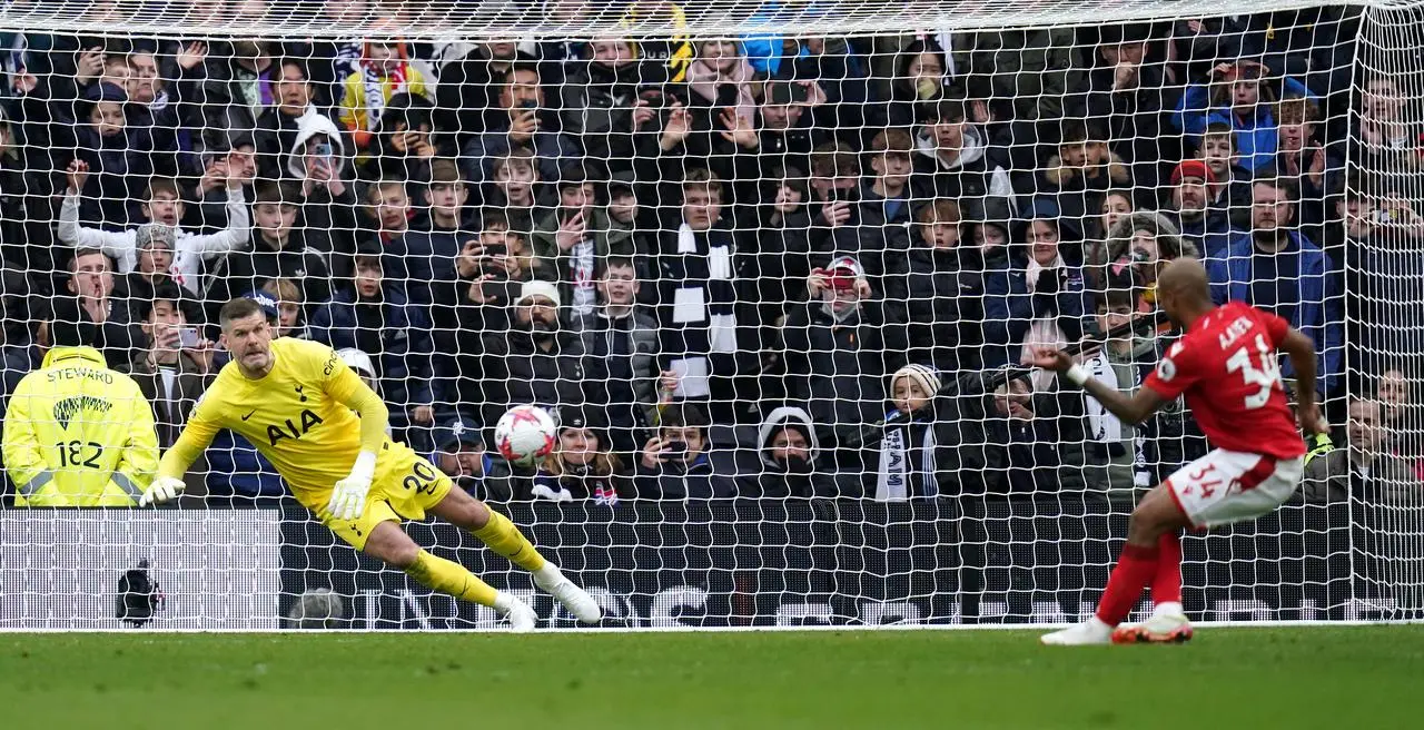 Fraser Forster saves a late penalty from Andre Ayew 