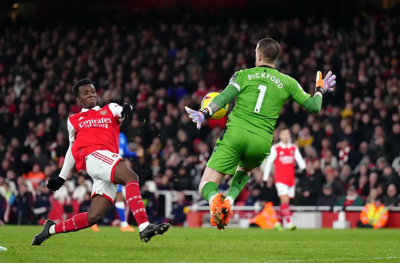 Eddie Nketiah (left) has a shot saved by Everton goalkeeper Jordan Pickford