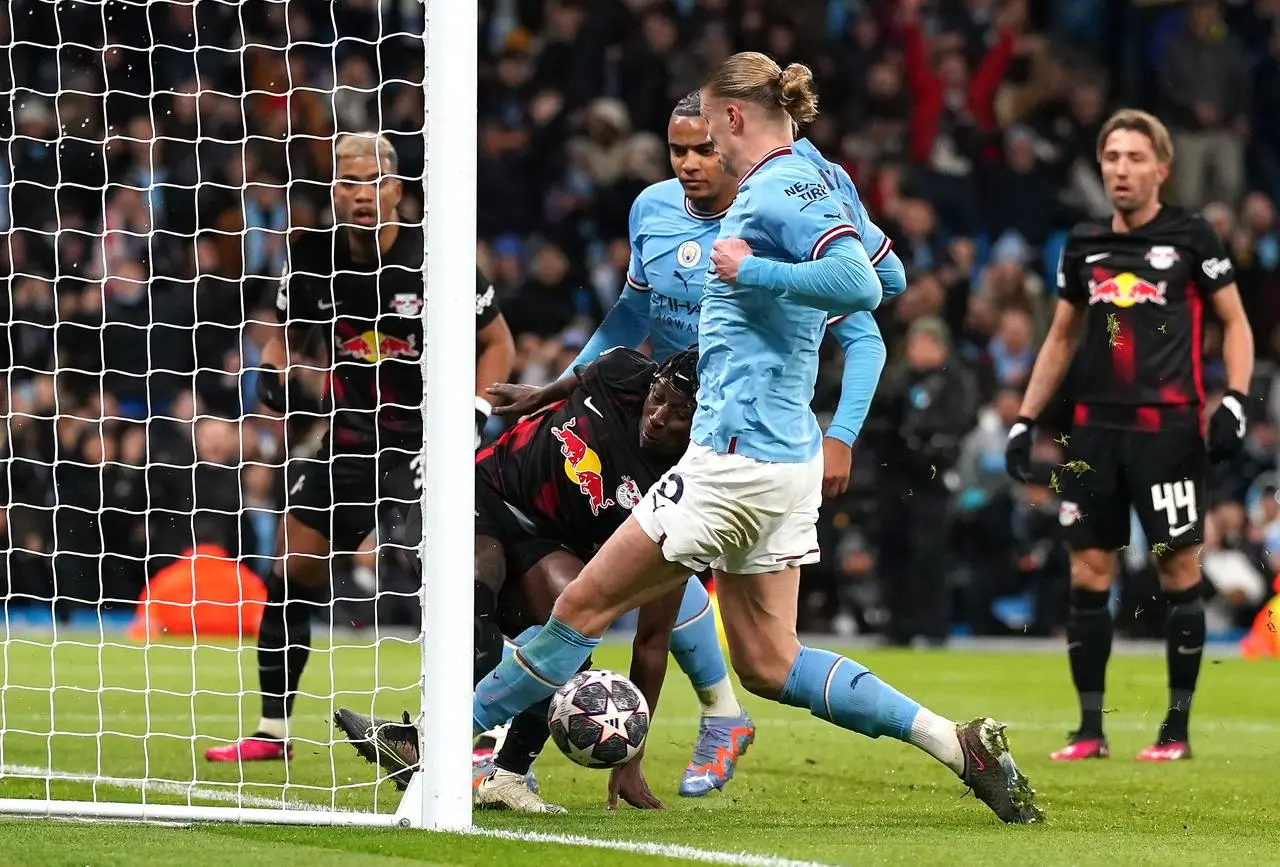 Erling Haaland bundles home his and Manchester City’s third goal