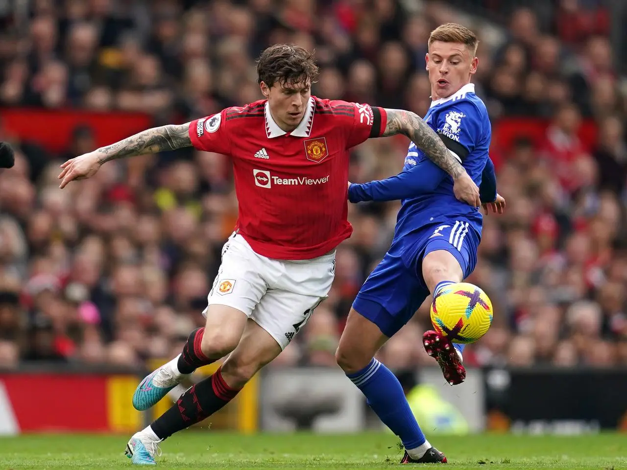 Victor Lindelof battles with Leicester City’s Harvey Barnes (Nick Potts/PA)