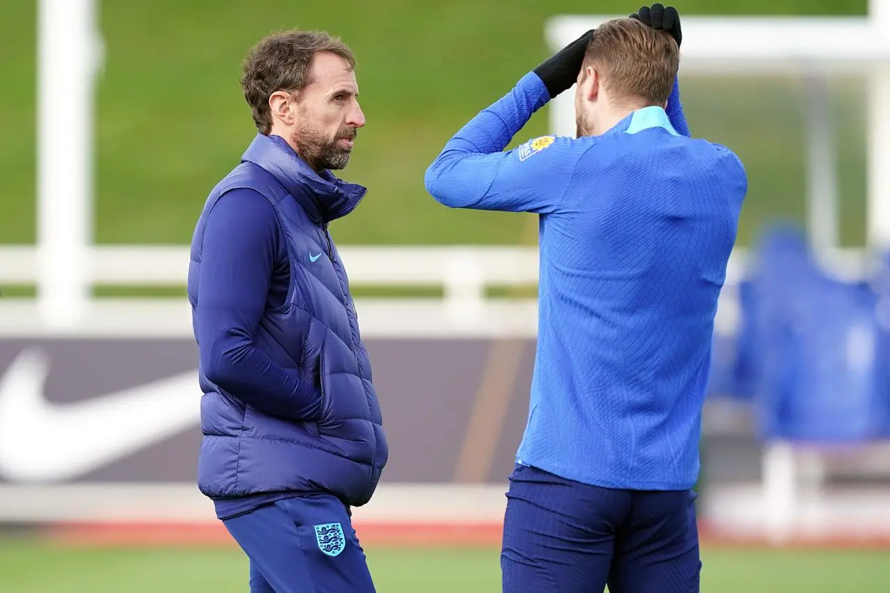 England head coach Gareth Southgate (left) chats with captain Harry Kane