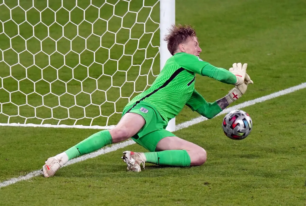 Jordan Pickford saves from Italy’s Andrea Belotti during the penalty shoot-out following the Euro 2020 final