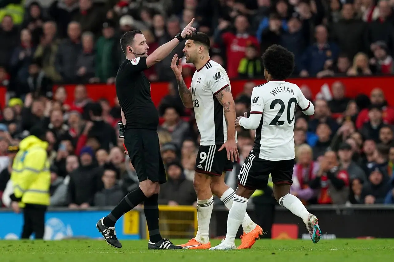 Aleksandar Mitrovic (centre) is sent off by referee Chris Kavanagh 