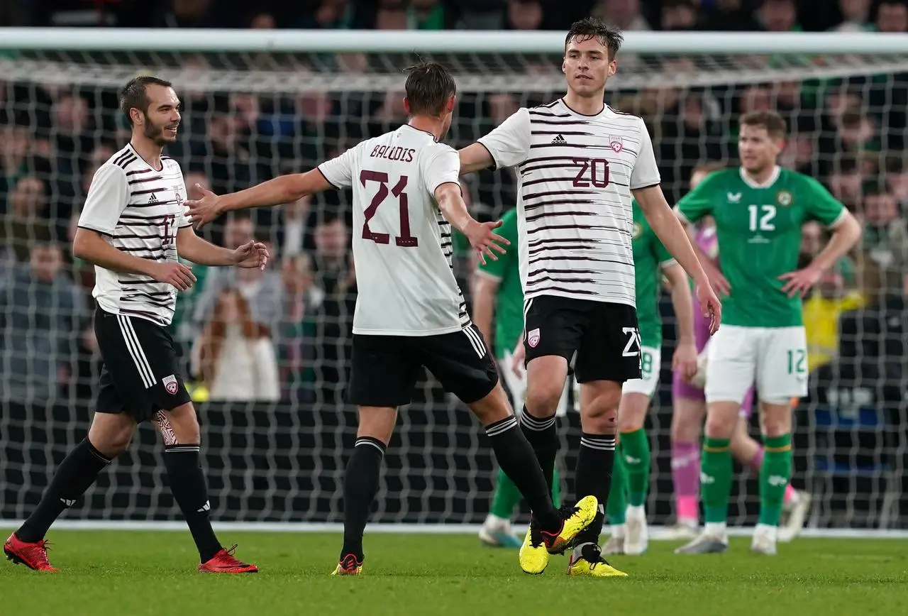 Latvia’s Roberts Uldrikis (right) celebrates scoring his sides first goal against the Republic of Ireland with a superb long-range strike