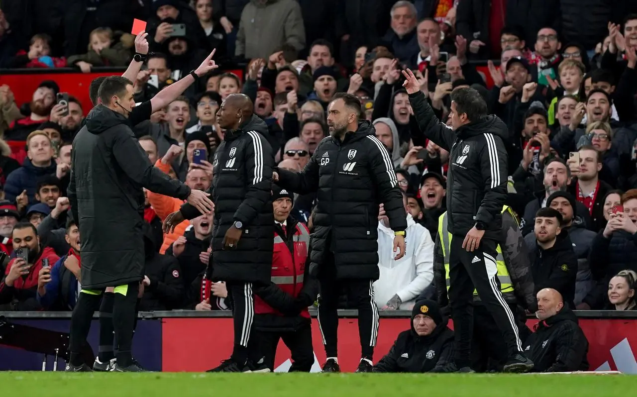 Fulham manager Marco Silva, right, being shown a red card