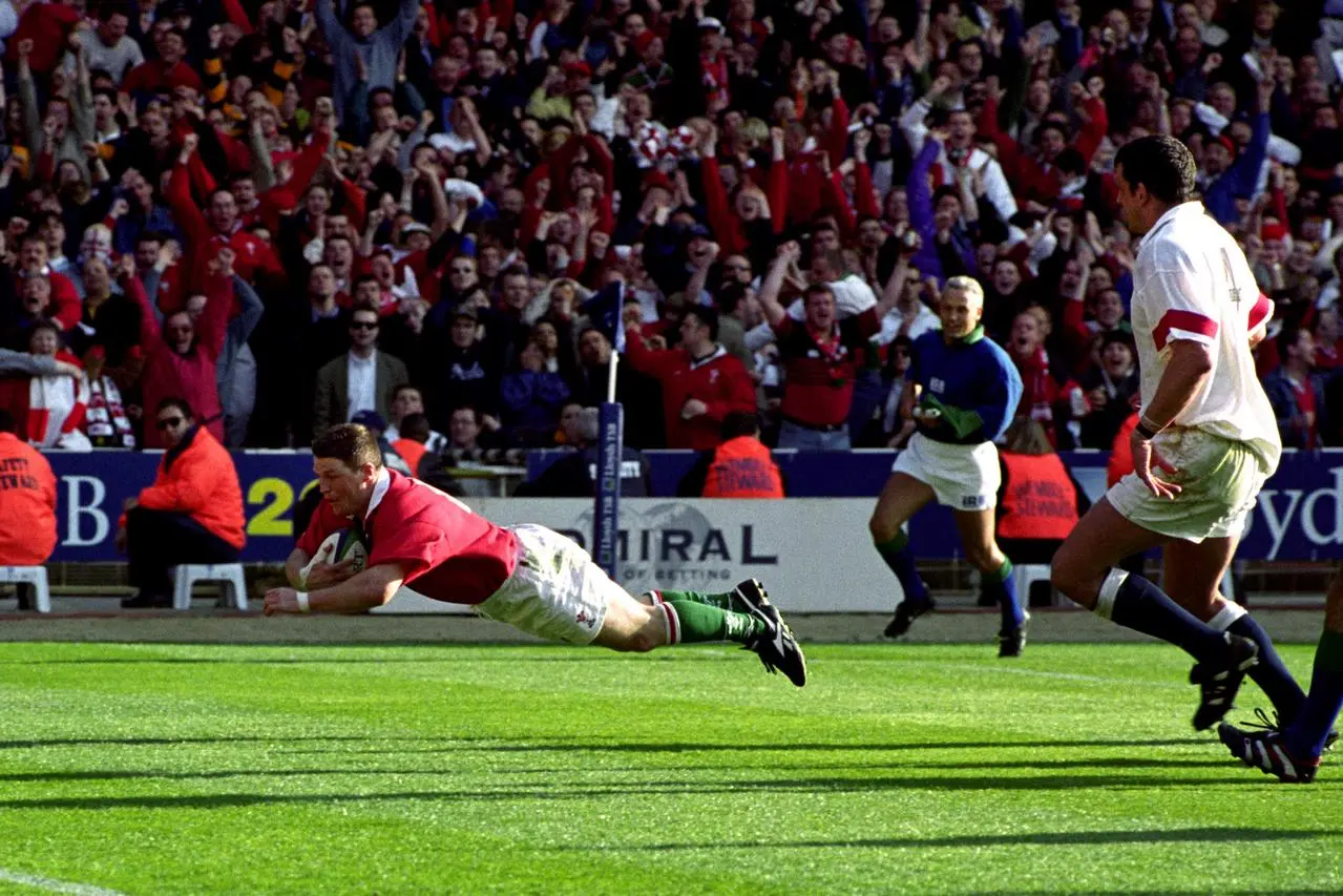 Wales’ Scott Gibbs crosses to allow Neil Jenkins to secure victory over England