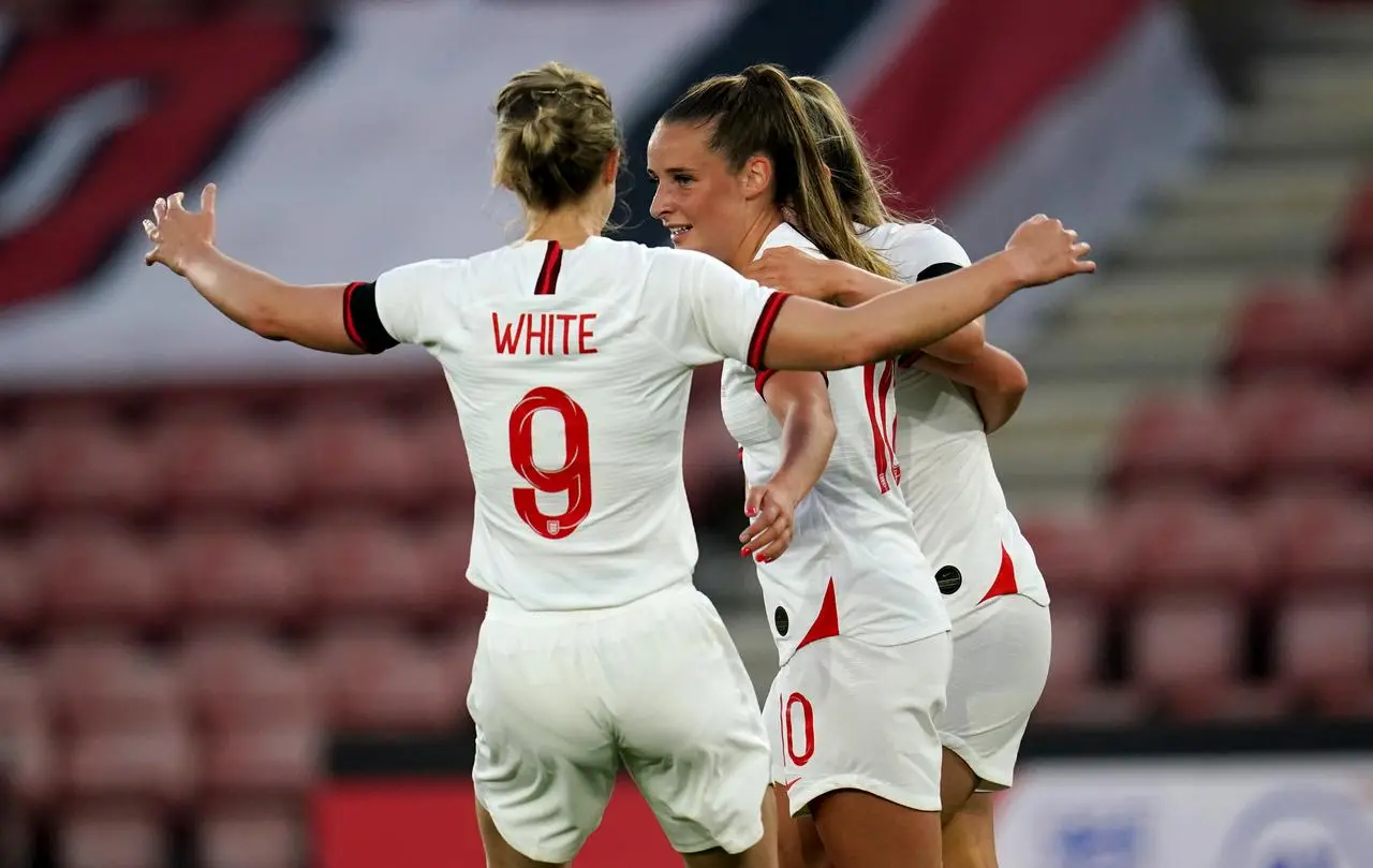 Ella Toone, centre, and England celebrate their opening goal against North Macedonia in September 2021