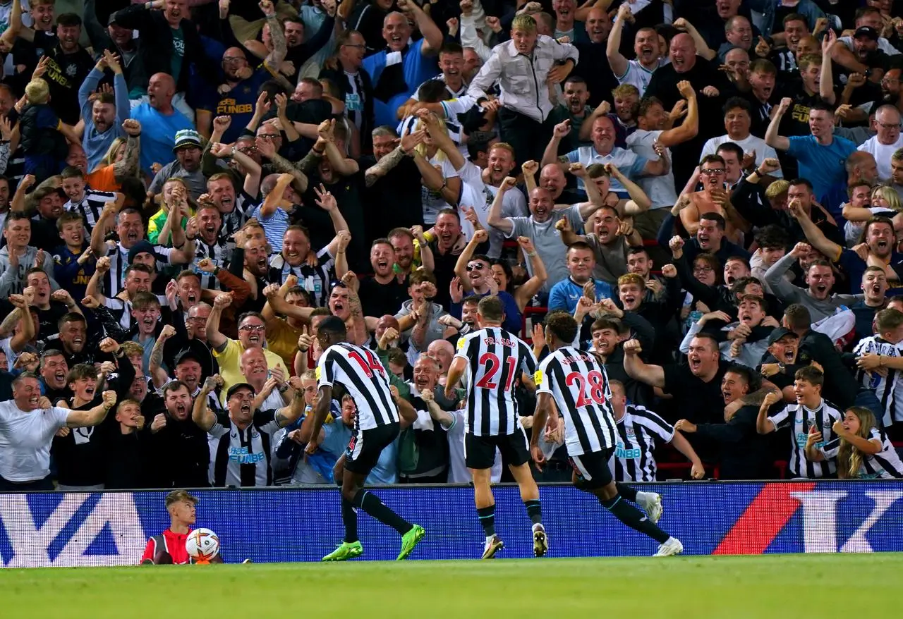 Newcastle’s Alexander Isak (left) celebrates his first goal for the club at Liverpool