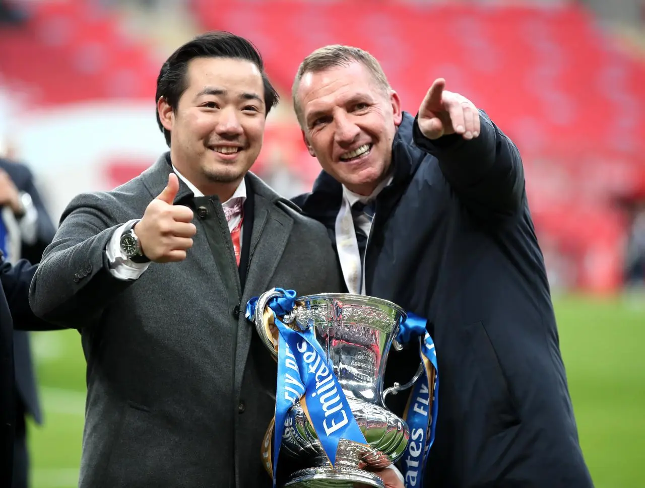 Brendan Rodgers, right, celebrates Leicester's FA Cup win with chairman Aiyawatt Srivaddhanaprabha