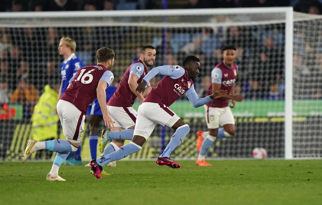 Bertrand Traore, centre right, celebrates his late winner for Aston Villa against Leicester