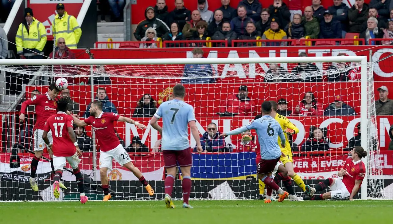 Douglas Luiz has an attempt blocked by Victor Lindelof