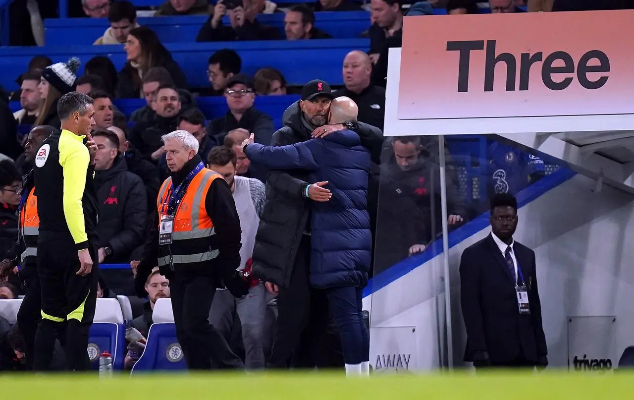 Jurgen Klopp, left, hugs Bruno Saltor after the game