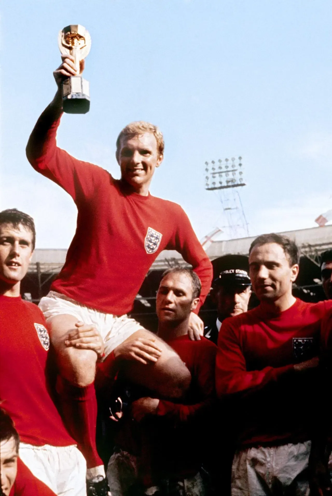 England captain Bobby Moore is held aloft by his team-mates after the World Cup final victory at Wembley in 1966