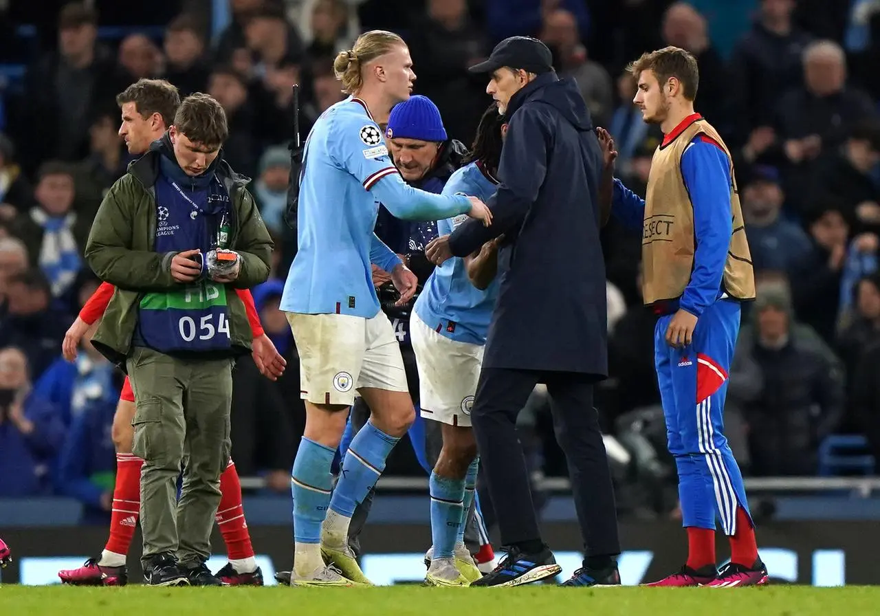 Thomas Tuchel, centre, congratulates Manchester City’s Erling Haaland, left, and Nathan Ake after the game