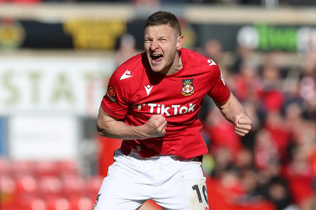 Wrexham's Paul Mullin celebrates after victory over Notts County