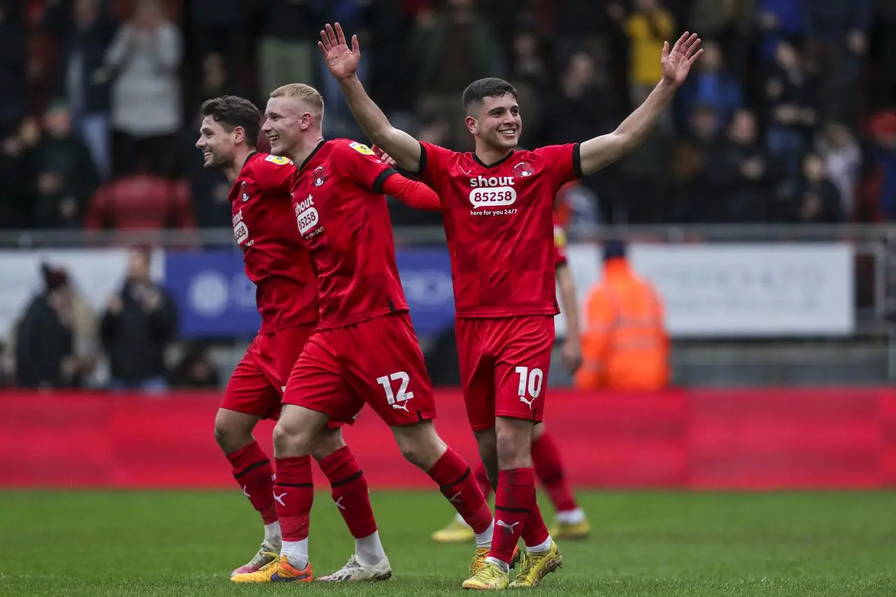 Leyton Orient’s Rob Hunt, Jordan Brown and Ruel Sotiriou, l-r, celebrate victory over Carlisle