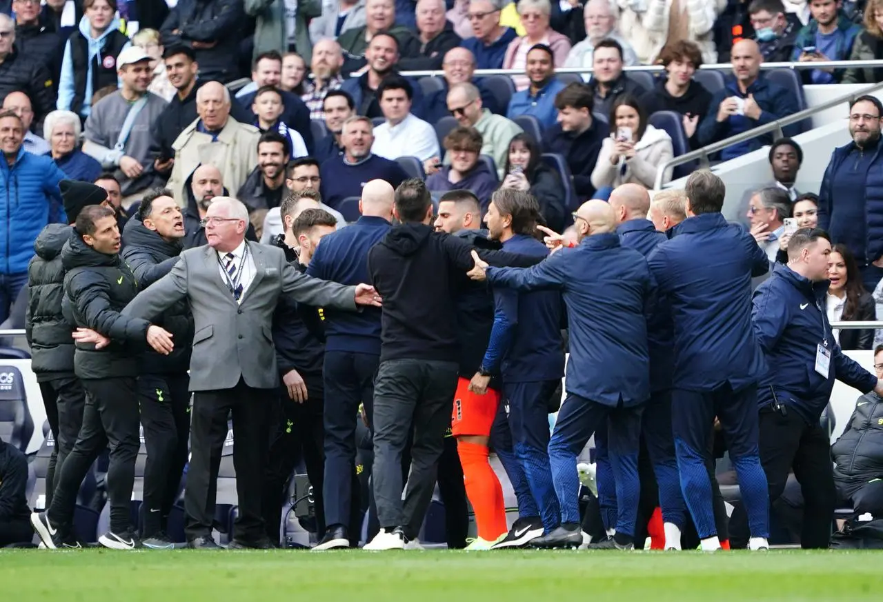 Both sets of coaches clash on the touchline