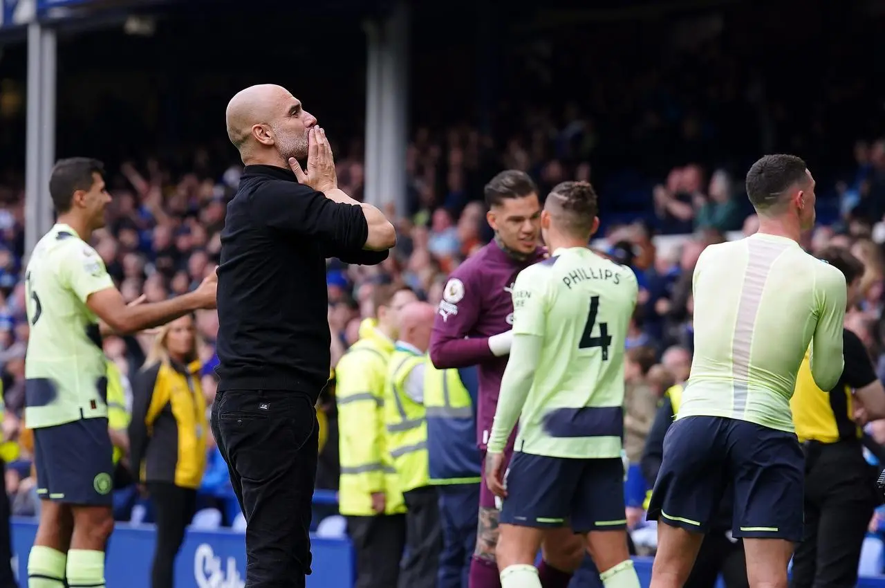 Guardiola celebrated with fans after winning at Everton 