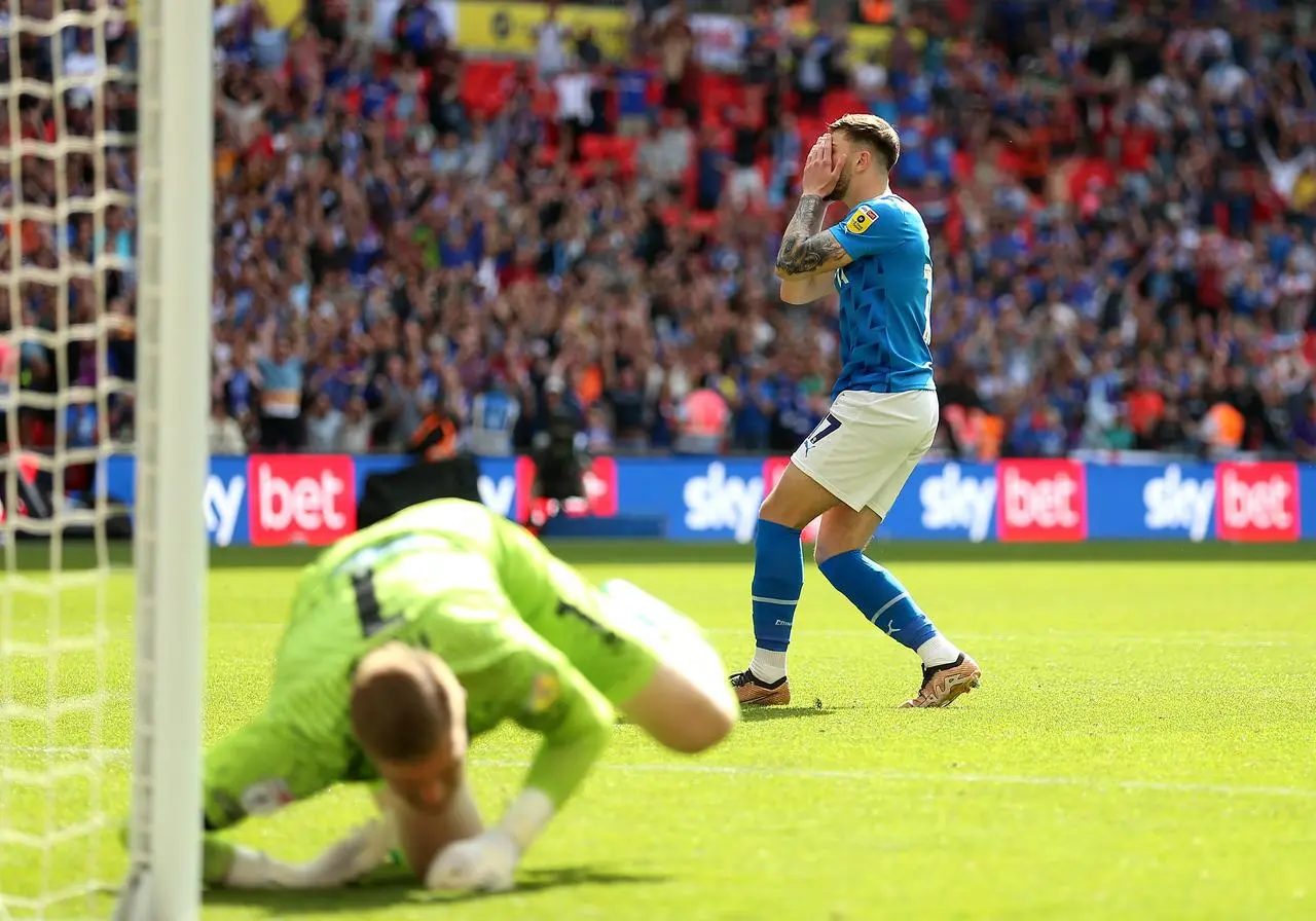 Stockport’s Ryan Rydel  reacts to missing his penalty 