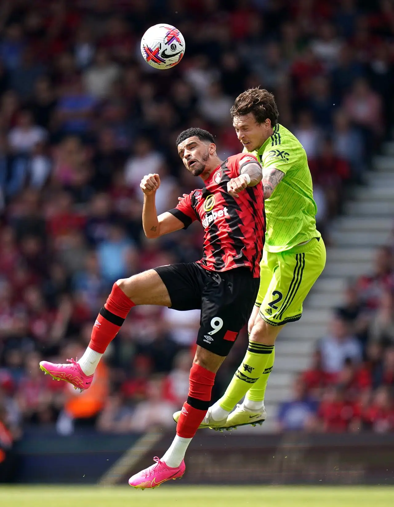 Dominic Solanke (left) and Victor Lindelof battle for the ball 