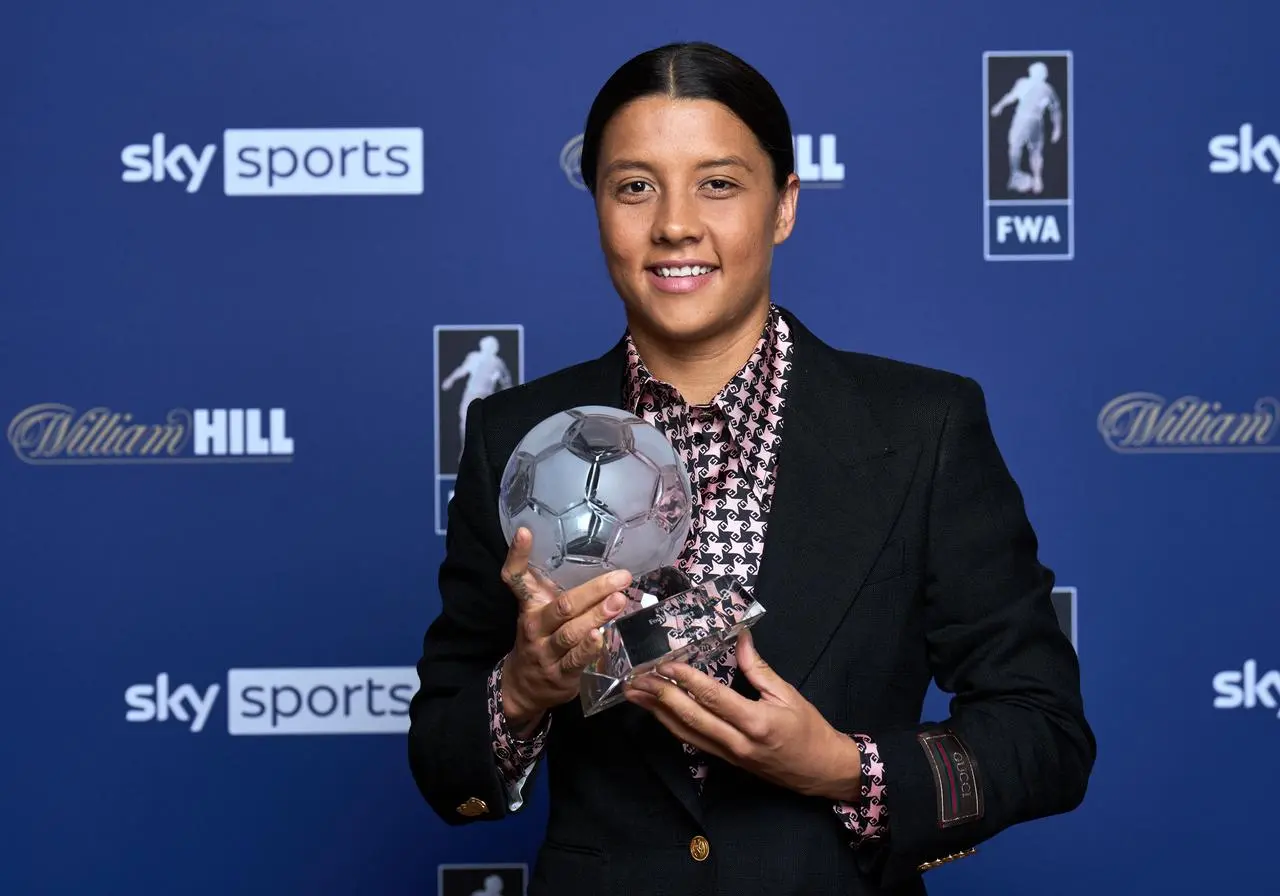 Chelsea forward Sam Kerr poses with the FWA's 2022 Footballer of the Year Award