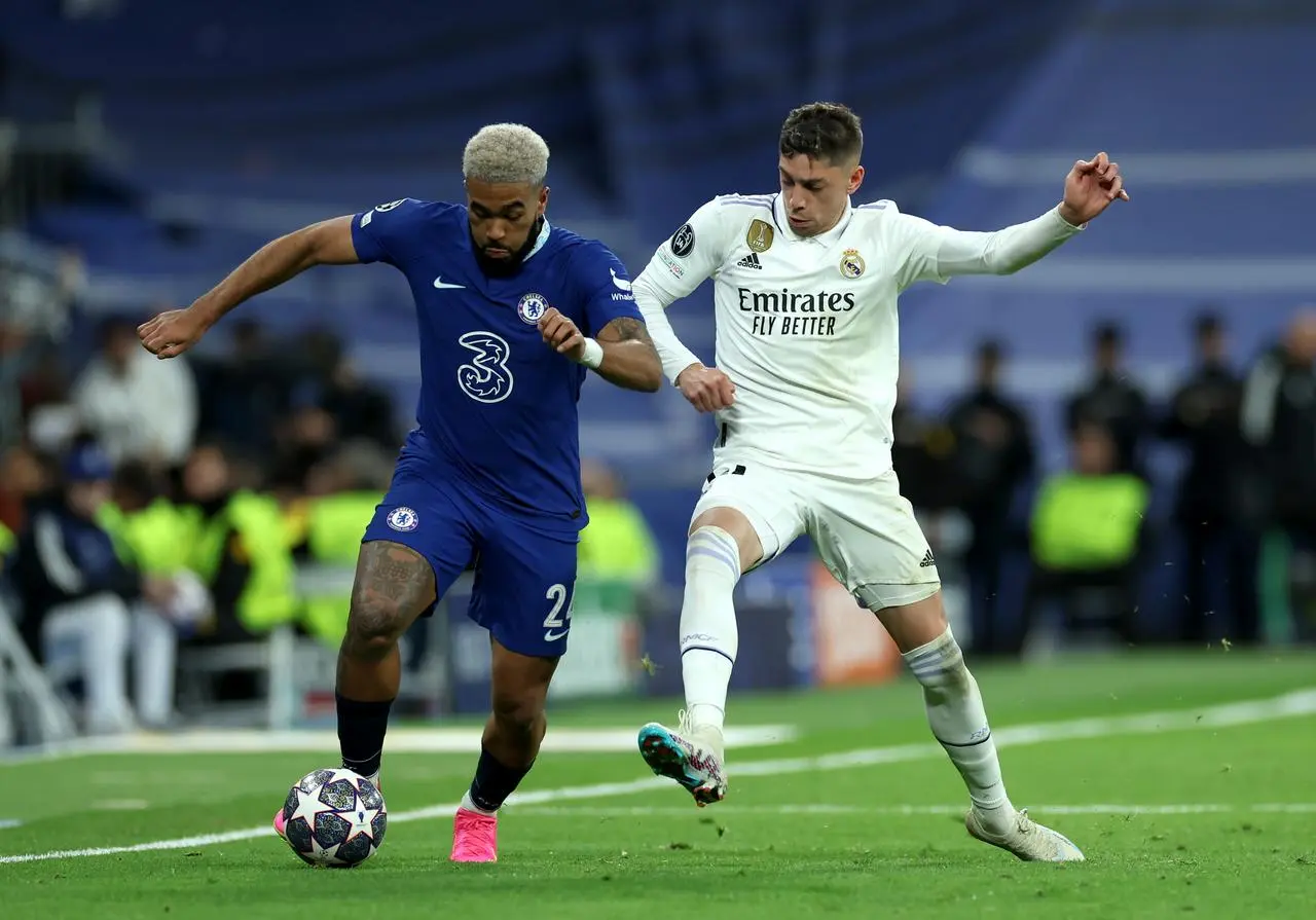 Reece James,. left, battles for the ball