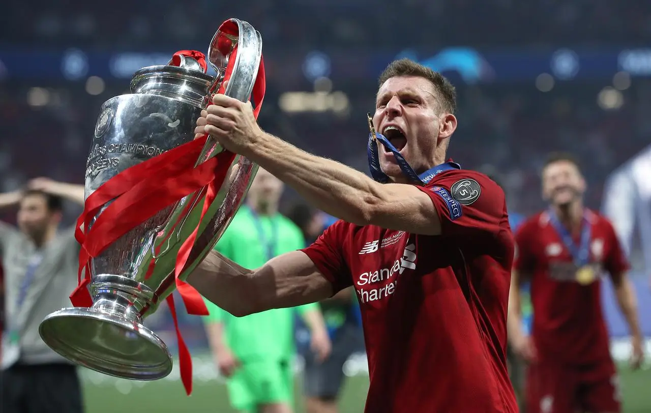 James Milner lifts the Champions League trophy 