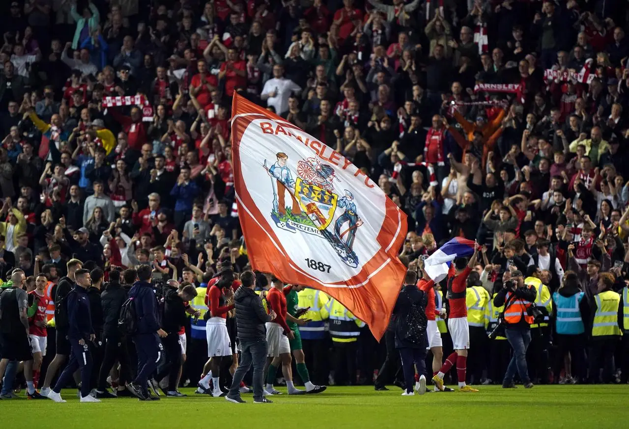 Barnsley’s players celebrate their play-off semi-final win against Bolton at Oakwell 