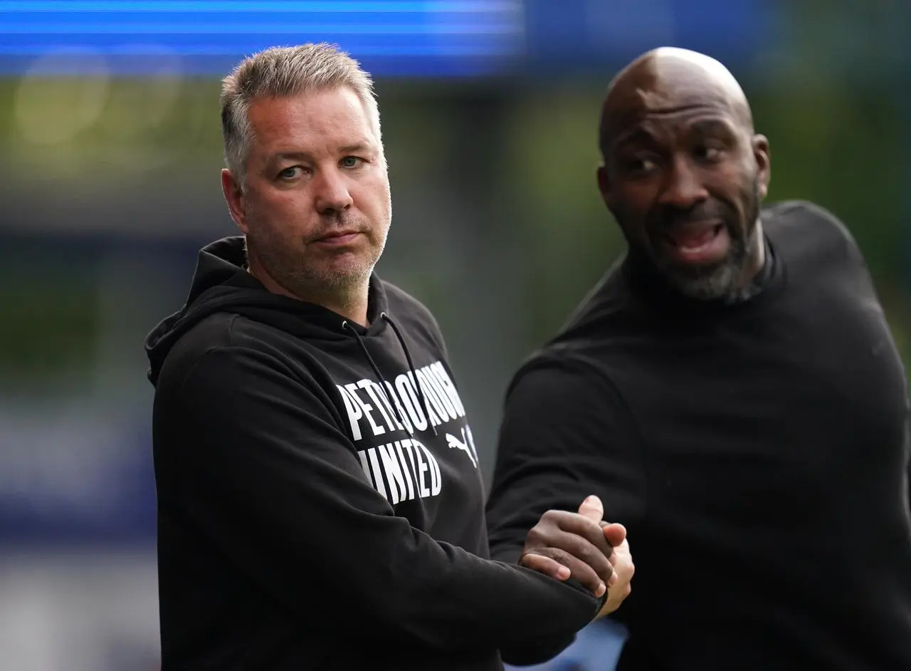 Sheffield Wednesday manager Darren Moore (right) and Peterborough United manager Darren Ferguson during Thursday night’s match