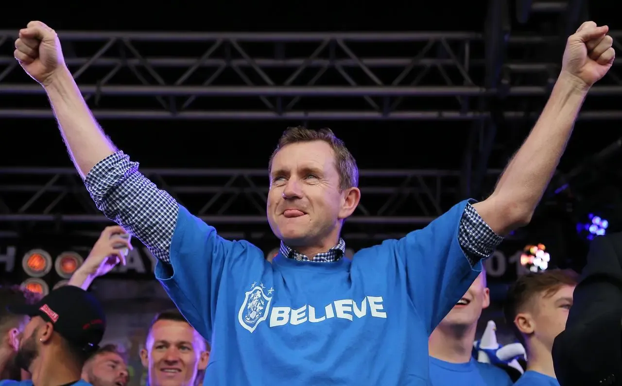 Huddersfield chairman Dean Hoyle on stage during a promotion parade 