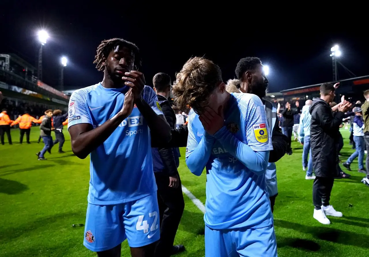 Sunderland’s Aji Alese, left, and Edouard Michut react to defeat to Luton 