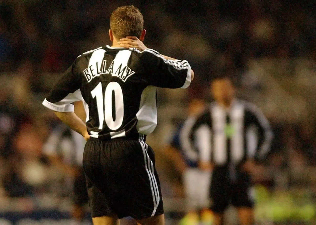 Dejected Newcastle striker Craig Bellamy left the field after being sent off against Inter Milan 