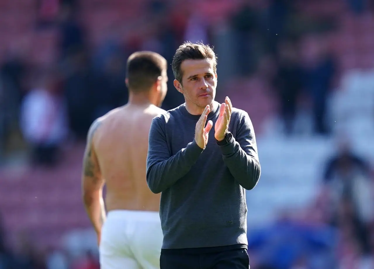 Marco Silva applauds the fans following the win 