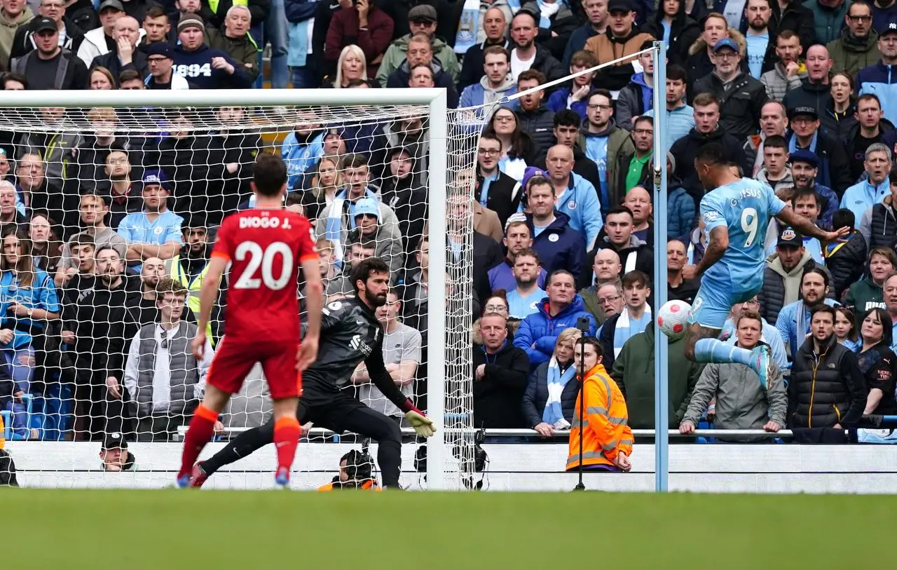 Gabriel Jesus, right, scores for Manchester City against Liverpool last season