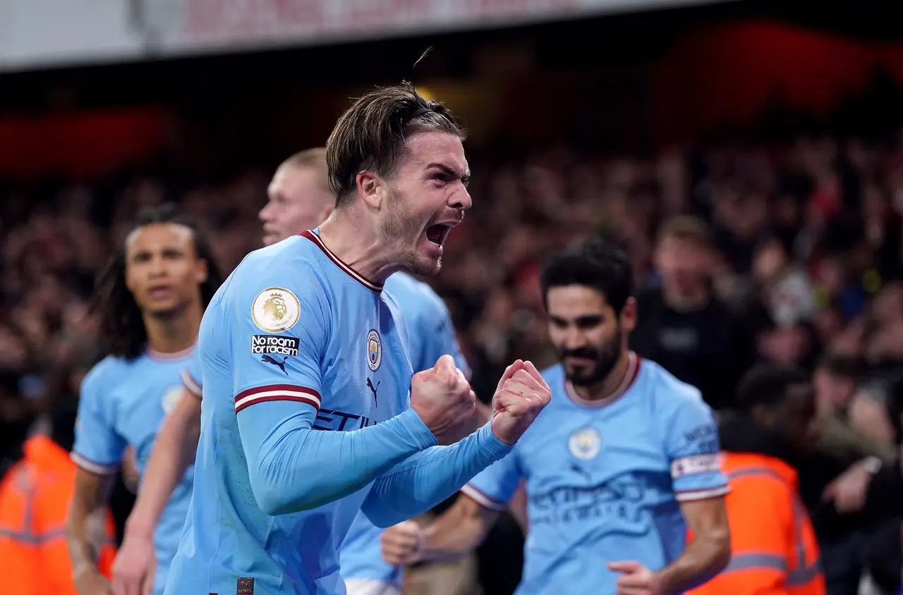 Jack Grealish celebrates scoring against Arsenal