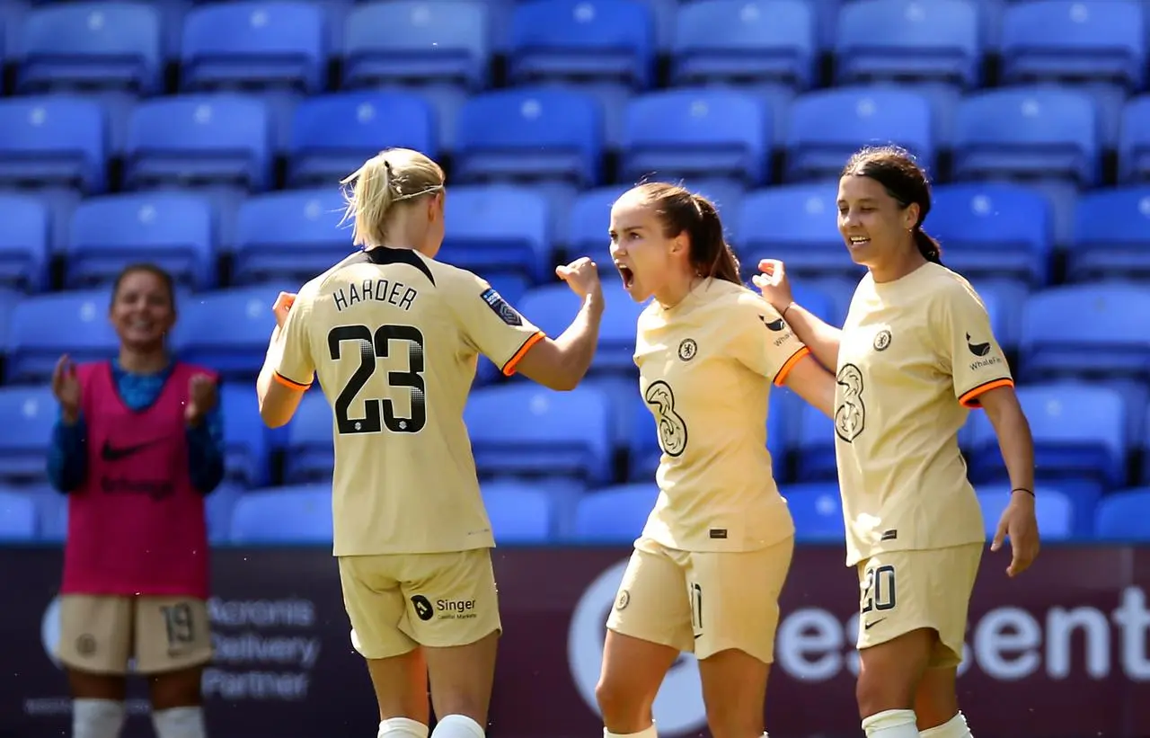 Guro Reiten, centre, celebrates her goal