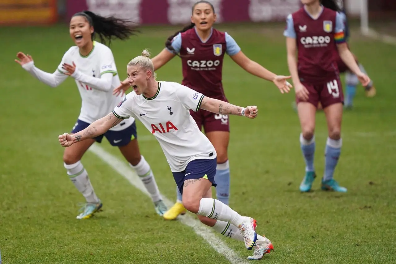 Bethany England (centre) celebrates scoring for Tottenham (Tim Goode/PA)