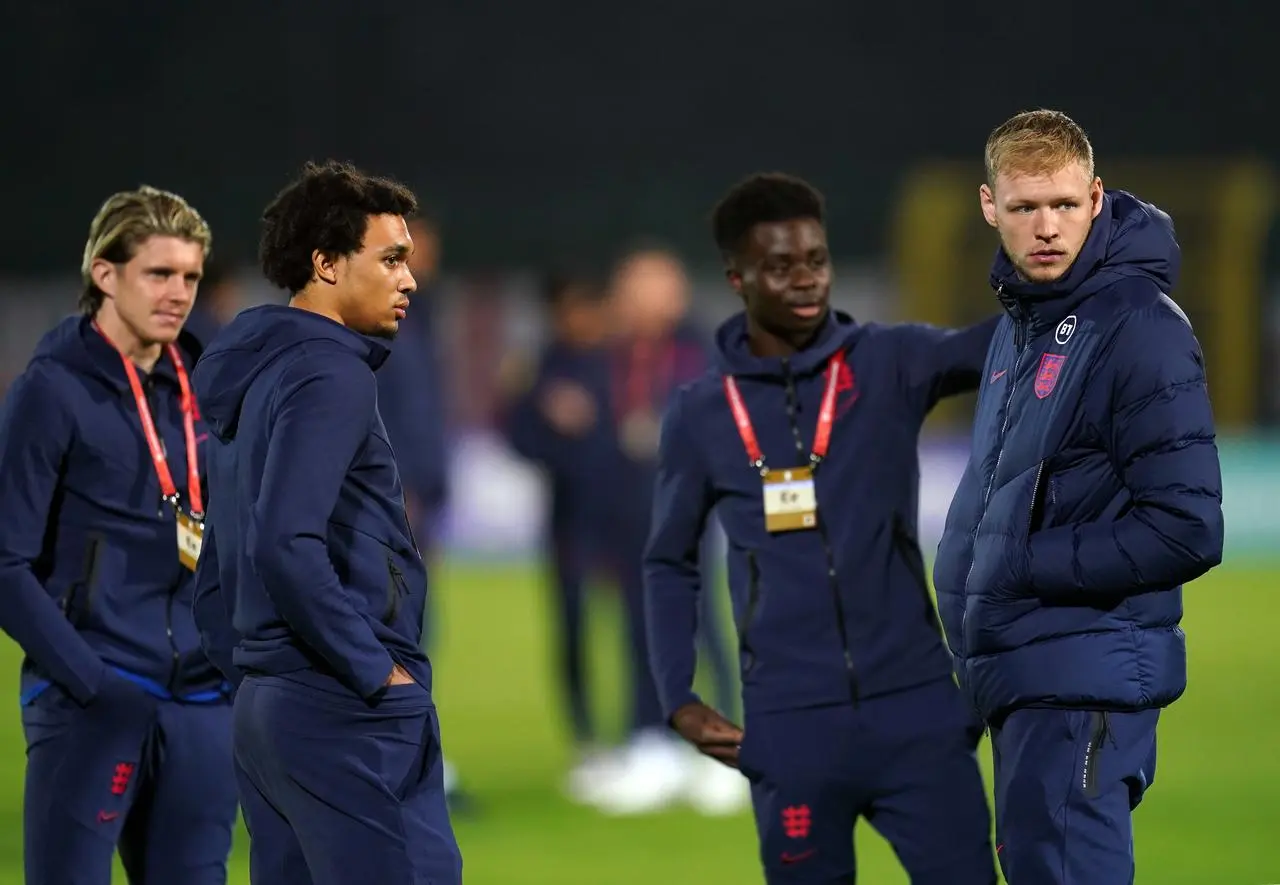 England’s Conor Gallagher, Trent Alexander-Arnold, Bukayo Saka and goalkeeper Aaron Ramsdale inspect the pitch before the World Cup qualifying match in San Marino in November 2021 