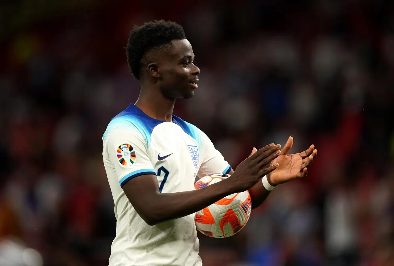 Bukayo Saka with the match ball after his hat-trick against North Macedonia on Monday 